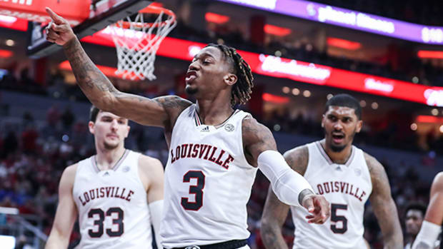 Louisville''s El Ellis celebrates after getting the shot and foul against Duke in the first half.